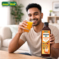 Person enjoying Sea Buckthorn Juice with Swaranfalam Amrit bottle